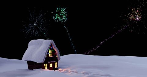 Snow-covered house illuminated by festive fireworks against dark sky presents a cozy winter scene ideal for holiday promotions, festive greeting cards, or social media posts announcing seasonal celebrations.