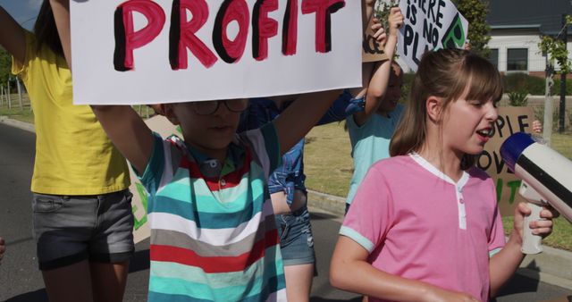 Young Activists Protesting with Signs and Megaphone for Environmental Awareness - Download Free Stock Images Pikwizard.com