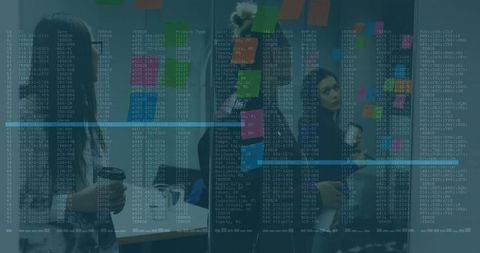 Tech Innovators Brainstorming with Digital Code Overlay