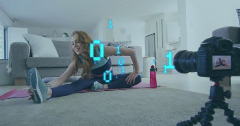 woman streaming online exercise program with binary graphics - Download Free Stock Images Pikwizard.com