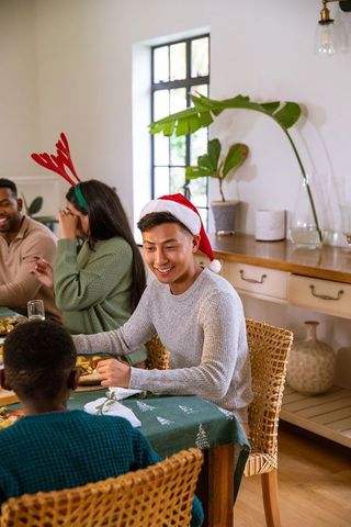 Diverse Group Enjoying Festive Holiday Meal Together