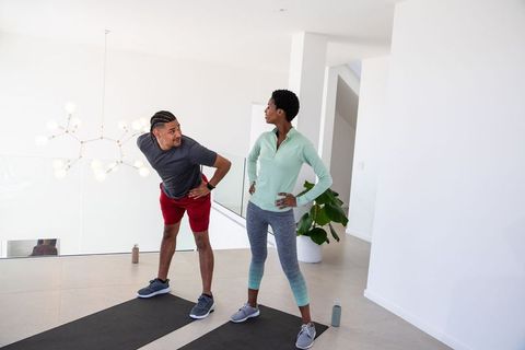 Diverse Couple Energized in Home Fitness Routine