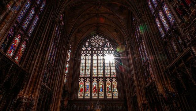 Sunlight through stained glass in gothic cathedral