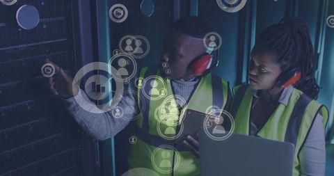 Technicians Analyzing Server Systems with Digital Interface