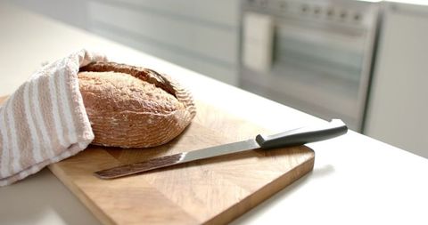 Freshly Baked Bread on Cutting Board with Knife - Download Free Stock Images Pikwizard.com