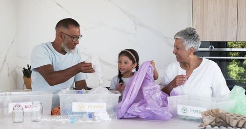Family Recycling Together at Home Encouraging Eco-Friendly Habits
