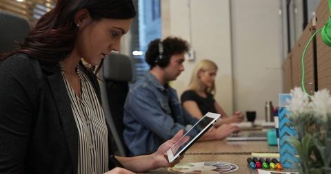 Creative Office Team Collaborating with Technology and Design Tools