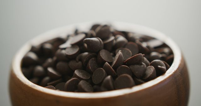 Close-Up of Dark Chocolate Chips in Wooden Bowl - Download Free Stock Images Pikwizard.com