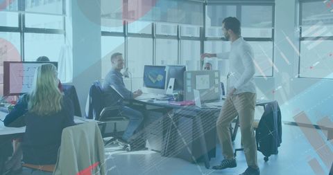 Diverse Team Analyzing Financial Data and Graphics in Modern Office