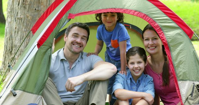 Smiling Family Enjoying Camping in Tent Outdoors - Download Free Stock Images Pikwizard.com