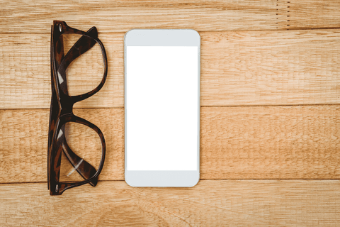 Transparent Smartphone and Glasses on Wooden Desk