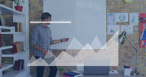 male teacher analyzing charts in modern classroom - Download Free Stock Images Pikwizard.com