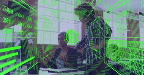 Collaborative team analyzing data on futuristic green HUD overlay in modern open office
