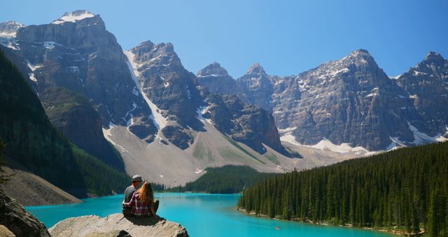 Couple Admiring Mountain Scenery Over Pristine Lake - Download Free Stock Images Pikwizard.com