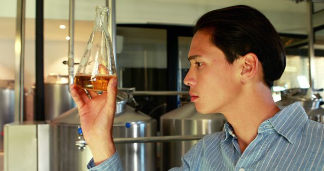 Young Scientist Analyzing Liquid in Laboratory - Download Free Stock Images Pikwizard.com