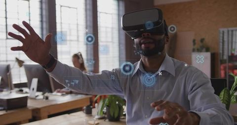 Man Engaging with Virtual Reality Headset in Modern Office Workspace