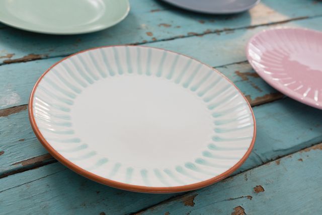 Modern empty plates on wooden table