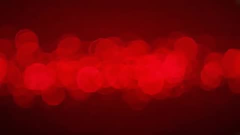 Looping horizontal red bokeh band pulsing across dark gradient backdrop