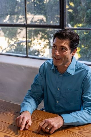 Business Professional Discussing Strategies in Modern Office