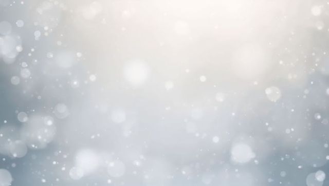 Falling Bokeh Orbs and Drifting Snow Creating Ethereal Soft Winter Light and Haze