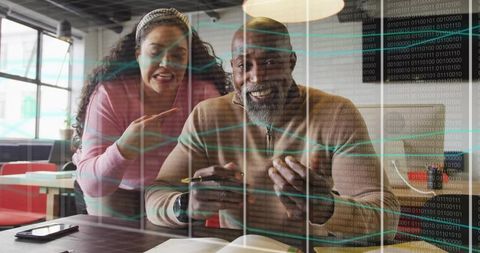 Senior Professional and Woman Collaborating on Tech Project