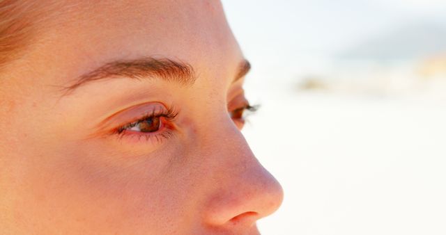 Close up of caucasian woman with brown eyes on beach - Download Free Stock Photos Pikwizard.com