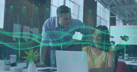 Colleagues collaborating amid digital data visualization