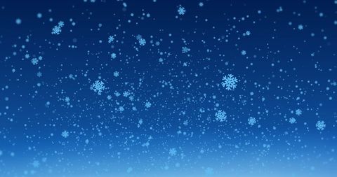 Snowflakes Gently Falling Against Clear Blue Sky