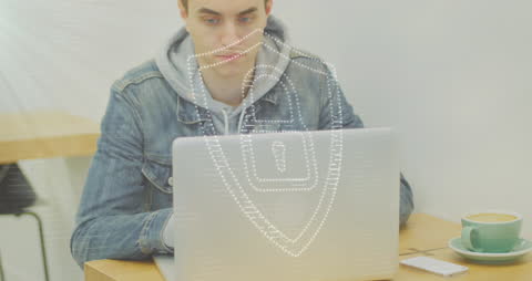 Man in Denim Jacket Using Laptop with Digital Security Overlay