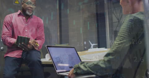 Business Professionals Analyzing Trends with Technology