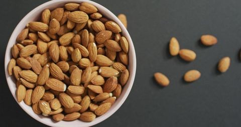 Bowl of Raw Almonds on Grey Background - Download Free Stock Images Pikwizard.com