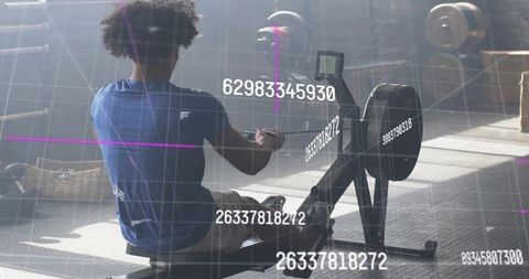 Athletic Man Training on Rowing Machine with Digital Overlay