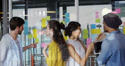 Innovative Team Collaborating in Modern Office with Sticky Notes
