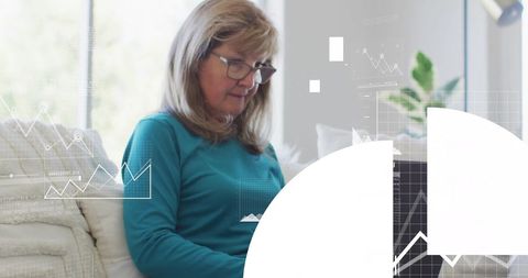 Senior Woman Engaging in Financial Data Analysis on Laptop