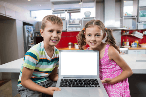 Smiling Siblings Displaying Laptop with Transparent Screen