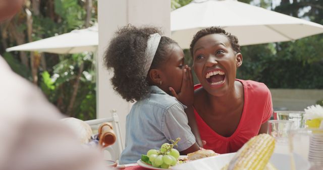 Mother and Daughter Sharing a Secret at Outdoor Dining Table - Download Free Stock Images Pikwizard.com