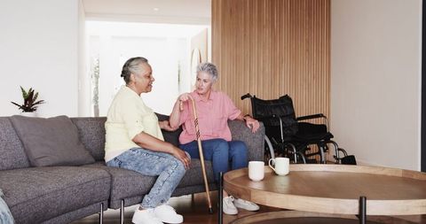 Lesbian senior couple supports each other in home setting