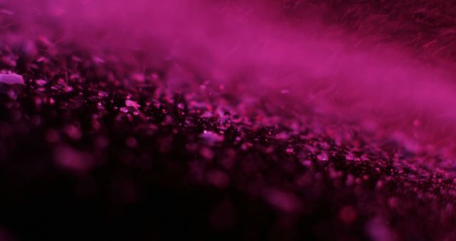 A close-up view of purple particles creates a mystical atmosphere. The image captures the texture and color gradient, evoking a sense of mystery or fantasy.