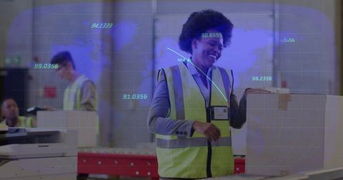 Smiling warehouse worker placing box on conveyor while tracking logistics analytics overlay