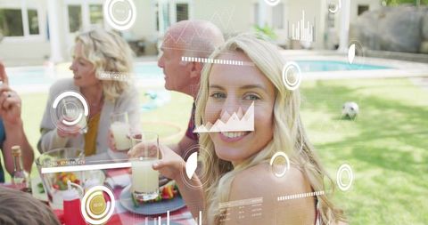 Smiling woman enjoying poolside picnic with family and augmented reality hud overlays