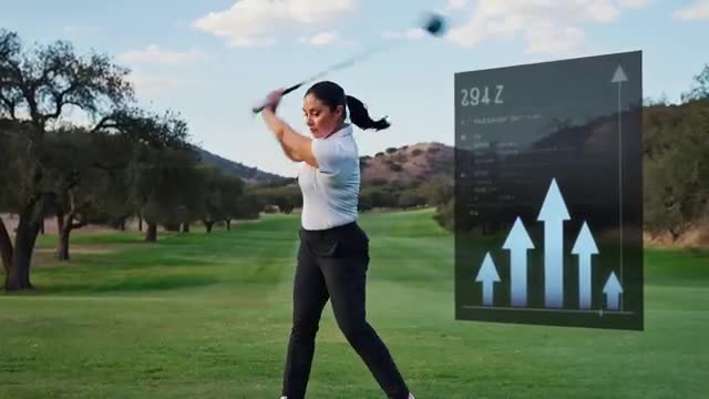 Female Golfer Analyzing Swing Performance with AI Technology