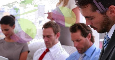 Diverse Team Analyzing Financial Data Insights for Global Business Strategy