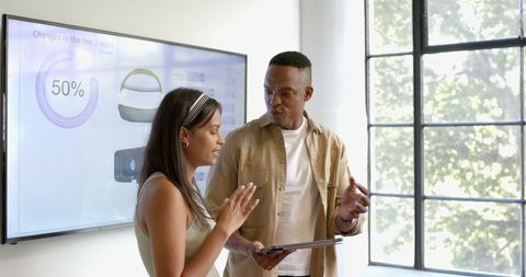 Professionals Collaborating with Technology for Business Strategy