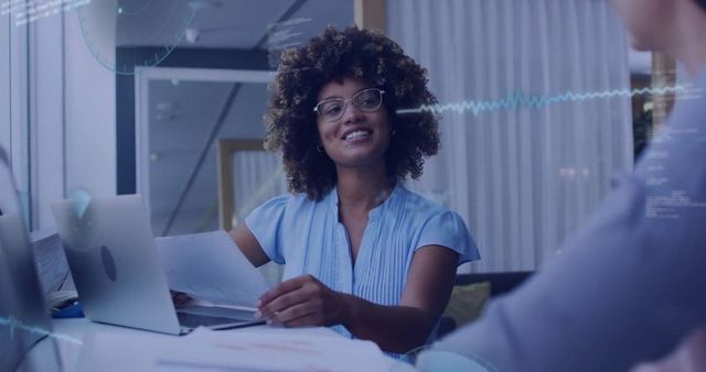 Professional Woman Analyzing Data and Engaging in Team Meeting