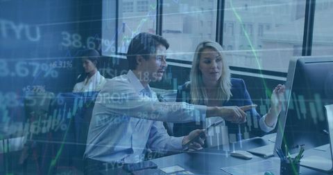 Entrepreneurs analyzing stock market trends on computer