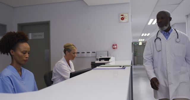 Medical Staff Working in Hospital Reception Area - Download Free Stock Images Pikwizard.com