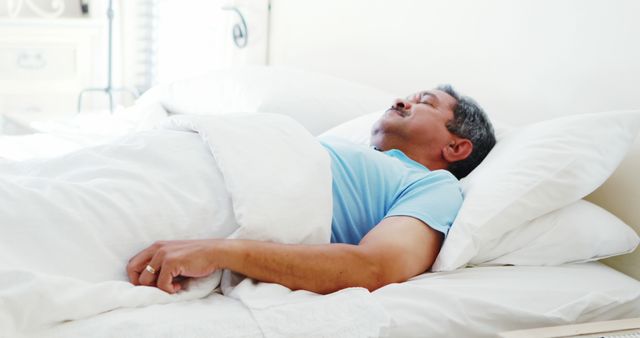 Elderly Man Sleeping Peacefully on Comfortable Bed in Morning Light - Download Free Stock Images Pikwizard.com