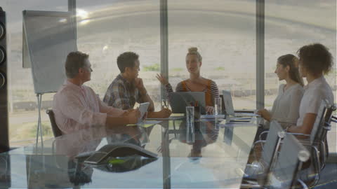Diverse Team in Conference Room Discussion with Holographic Interface