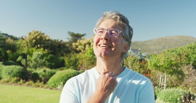 Happy senior caucasian man in garden on sunny day at retirement home - Download Free Stock Photos Pikwizard.com