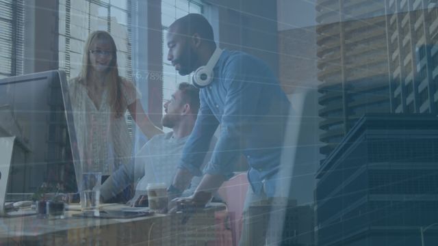 Diverse coworkers stand and sit around a desk discussing reports, with a digital overlay of graphs and changing numbers. Use for concepts of teamwork, data-driven decision-making, business growth, financial analysis, corporate strategy sessions, and office collaboration. Highlights integration of technology in the business environment.